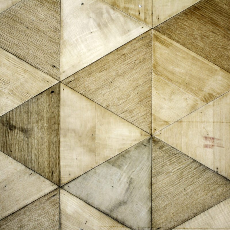 Wooden triangles bring modern elegance to the guest bathroom wall